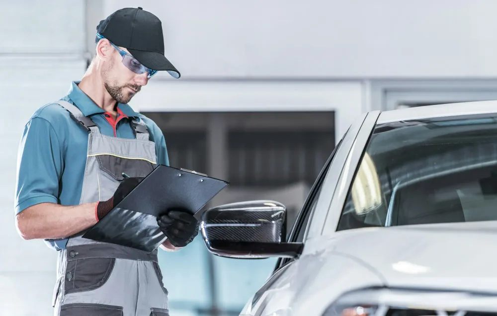 Certified technician inspecting a vehicle